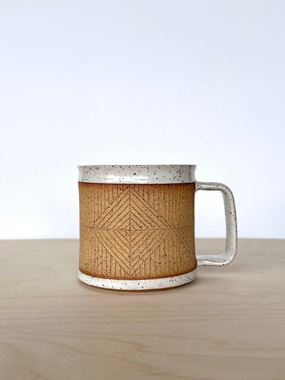 Handmade wheel-thrown ceramic mug with hand-carved diamond pattern and contrasting white glaze, 16 oz stoneware mug, unique pottery mug Vancouver Island, small-batch handmade ceramics Canada. Handle facing right. 