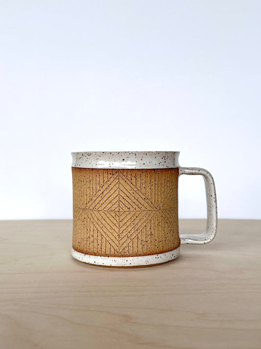 Handmade wheel-thrown ceramic mug with hand-carved diamond pattern and contrasting white glaze, 16 oz stoneware mug, unique pottery mug Vancouver Island, small-batch handmade ceramics Canada. Handle facing right. 