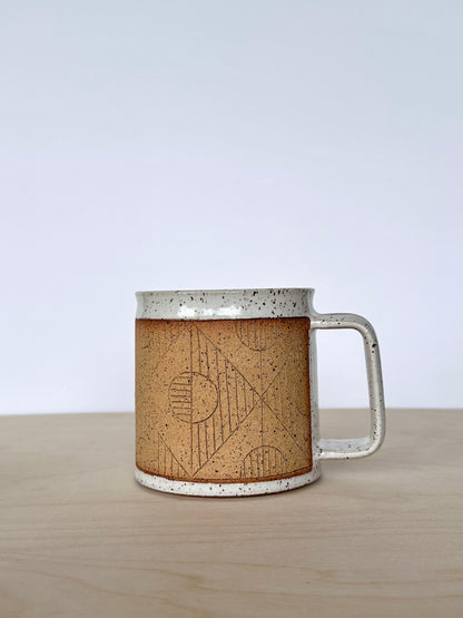 Handmade wheel-thrown ceramic mug with hand-carved circle pattern, 16 oz stoneware mug, unique pottery mug Vancouver Island, small-batch handmade ceramics Canada. Handle facing right. 